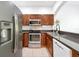 Well-equipped kitchen with stainless steel appliances and dark granite countertops at 10374 Park Commons Dr, Orlando, FL 32832
