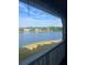 Scenic view from the balcony overlooking a serene lake surrounded by verdant trees at 1065 S Hiawassee Rd # 1434, Orlando, FL 32835