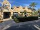 Inviting clubhouse exterior featuring a well-maintained landscape and prominent building number at 1065 S Hiawassee Rd # 1434, Orlando, FL 32835