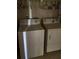 Practical laundry area equipped with a functional washer and dryer for convenience at 1065 S Hiawassee Rd # 1434, Orlando, FL 32835
