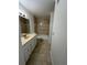 Standard bathroom with single sink, toilet, and a shower-tub combo with tiled walls at 1079 S Hiawassee Rd # 1121, Orlando, FL 32835