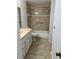 Bathroom featuring a shower-tub combo with tiled walls and vanity at 1079 S Hiawassee Rd # 1121, Orlando, FL 32835