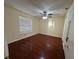 Bedroom with hardwood floors, ceiling fan, and natural light at 1079 S Hiawassee Rd # 1121, Orlando, FL 32835