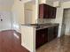 Kitchen featuring granite countertops, stainless steel appliances, and dark cabinetry at 1079 S Hiawassee Rd # 1121, Orlando, FL 32835