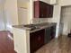Kitchen featuring granite countertops, stainless steel appliances, and dark cabinetry at 1079 S Hiawassee Rd # 1121, Orlando, FL 32835