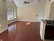Open-concept living area featuring dark wood floors and large windows for plenty of natural light at 1079 S Hiawassee Rd # 1121, Orlando, FL 32835