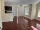 Open-concept living space with a kitchen counter overlooking the dark wood floors and natural light at 1079 S Hiawassee Rd # 1121, Orlando, FL 32835