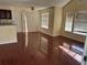 Spacious living area with dark wood floors, large windows, and sliding glass doors at 1079 S Hiawassee Rd # 1121, Orlando, FL 32835
