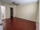 Main bedroom featuring hardwood floors and an ensuite bathroom and walk-in closet at 1079 S Hiawassee Rd # 1121, Orlando, FL 32835