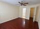 Main bedroom with hardwood floors and connections to bathroom and closet at 1079 S Hiawassee Rd # 1121, Orlando, FL 32835