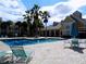 Community pool with lounge chairs and tables at 1079 S Hiawassee Rd # 1121, Orlando, FL 32835
