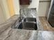 Double sink with updated faucet and stone countertops at 1079 S Hiawassee Rd # 1121, Orlando, FL 32835