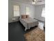 Cozy bedroom featuring neutral decor and two small side tables at 111 E 8Th St, Sanford, FL 32771