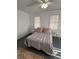 Bright bedroom with neutral decor and simple ceiling fan at 111 E 8Th St, Sanford, FL 32771