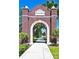 Brick entrance to historic Sanford with manicured grounds and walking path at 111 E 8Th St, Sanford, FL 32771