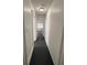 Hallway leads to bedrooms, living spaces, and bathroom at 111 E 8Th St, Sanford, FL 32771