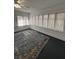 Bright living room with large windows and a new ceiling fan at 111 E 8Th St, Sanford, FL 32771
