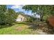Spacious backyard with lush lawn and mature trees at 1156 Brandy Lake View Cir, Winter Garden, FL 34787