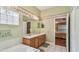 Bathroom featuring tub, a vanity with double sinks, and a glimpse of the main bedroom at 1156 Brandy Lake View Cir, Winter Garden, FL 34787