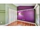 Bedroom featuring colorful walls, built-in shelving, and wood-look floors at 1156 Brandy Lake View Cir, Winter Garden, FL 34787