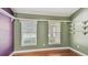 Bedroom features natural light, built in shelving for storage, and wood flooring at 1156 Brandy Lake View Cir, Winter Garden, FL 34787