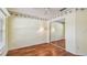 Bright bedroom with hardwood floors, ceiling fan, and mirrored closet doors at 1156 Brandy Lake View Cir, Winter Garden, FL 34787