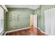 Bedroom with wood floors, white shelving, and a closet or connecting room at 1156 Brandy Lake View Cir, Winter Garden, FL 34787