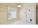 Breakfast nook with tile floor, window and door to the exterior, plus open shelving at 1156 Brandy Lake View Cir, Winter Garden, FL 34787