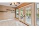 Dining area features ceramic tile flooring and sliding glass doors that lead to the screened in patio at 1156 Brandy Lake View Cir, Winter Garden, FL 34787