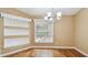 Inviting dining room with hardwood floors, built-in shelving, and a chandelier at 1156 Brandy Lake View Cir, Winter Garden, FL 34787