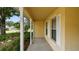 Inviting front porch with white columns and shutters offering a welcoming entrance to the home at 1156 Brandy Lake View Cir, Winter Garden, FL 34787