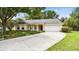 Charming single-story home with an attached two car garage, landscaped front yard, and inviting curb appeal at 1156 Brandy Lake View Cir, Winter Garden, FL 34787
