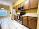 Bright kitchen featuring stainless steel appliances and ample cabinet space at 1156 Brandy Lake View Cir, Winter Garden, FL 34787
