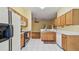 Open kitchen with stainless appliances and a view into the living area at 1156 Brandy Lake View Cir, Winter Garden, FL 34787