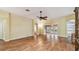 Open-concept living room featuring hardwood floors and seamless transition to outdoor patio at 1156 Brandy Lake View Cir, Winter Garden, FL 34787