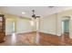 Spacious living room with hardwood floors and arched doorways allows for seamless flow throughout the home at 1156 Brandy Lake View Cir, Winter Garden, FL 34787