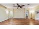 Large living room with hardwood floors and arched doorways allows for seamless flow throughout the home at 1156 Brandy Lake View Cir, Winter Garden, FL 34787