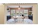 Staged office with ceramic tile flooring, natural light, and French doors leading to outdoor patio at 1156 Brandy Lake View Cir, Winter Garden, FL 34787
