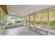 A view of the screened-in lanai that features concrete floors and natural lighting at 1156 Brandy Lake View Cir, Winter Garden, FL 34787