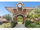 Charming town entrance with a clock tower, brick structure, and inviting walkway into town at 1156 Brandy Lake View Cir, Winter Garden, FL 34787