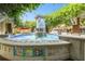 Picturesque fountain in a town square with lush greenery and outdoor seating at 1156 Brandy Lake View Cir, Winter Garden, FL 34787