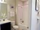 Cozy bathroom with a bathtub and shower, a vanity with a sink, and tasteful wall decor for a welcoming feel at 11746 Water Run Aly, Windermere, FL 34786