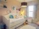 Bright bedroom with a daybed, plush carpet, and playful decor accents at 11746 Water Run Aly, Windermere, FL 34786