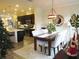 Dining area featuring modern lighting, stylish decor, and seamless flow to the kitchen at 11746 Water Run Aly, Windermere, FL 34786