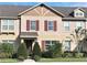 Charming townhome featuring a well-maintained lawn and inviting curb appeal at 11746 Water Run Aly, Windermere, FL 34786