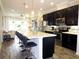 Modern kitchen featuring a large island with breakfast bar and stainless steel appliances at 11746 Water Run Aly, Windermere, FL 34786