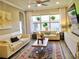 Inviting living area with large windows providing ample natural light and cozy seating at 11746 Water Run Aly, Windermere, FL 34786