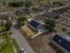 Aerial view shows a fenced backyard and well-maintained lawn, highlighting the home's outdoor space at 119 Argyle Gate Loop Rd, Dundee, FL 33838