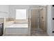 This bathroom offers a large soaking tub with a glass enclosed shower at 119 Argyle Gate Loop Rd, Dundee, FL 33838