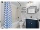 Bathroom featuring a shower-tub combo, vanity with storage, and floating shelves at 119 Argyle Gate Loop Rd, Dundee, FL 33838
